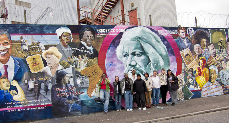 Bleeding Pines Group in front of mural in Belfast